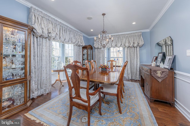 dining room with ornamental molding, dark wood-type flooring, and plenty of natural light