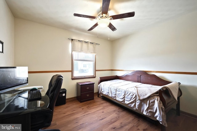 bedroom with wood-type flooring and ceiling fan