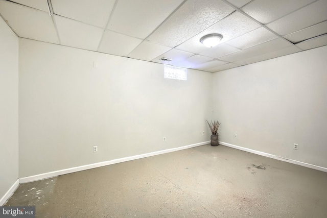 basement featuring a paneled ceiling