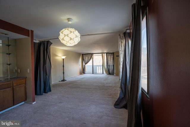 unfurnished room with light colored carpet