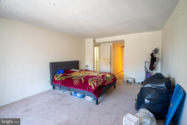 carpeted bedroom with a textured ceiling