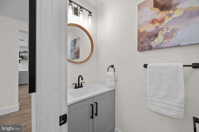 bathroom featuring vanity and hardwood / wood-style flooring