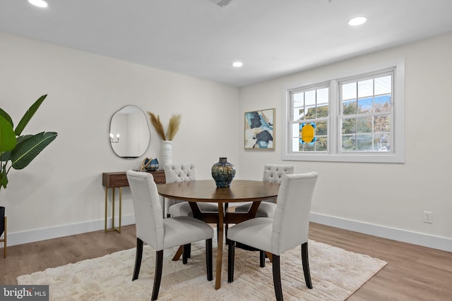 dining room featuring light hardwood / wood-style floors