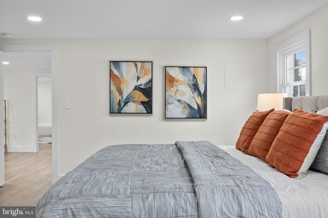 bedroom with light hardwood / wood-style floors