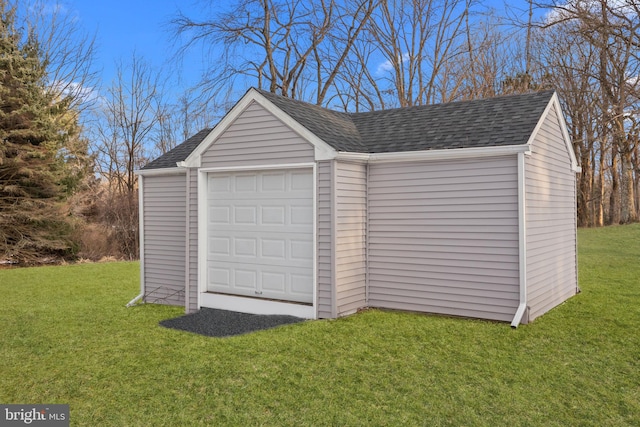 garage featuring a lawn