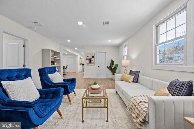 living room with light hardwood / wood-style flooring