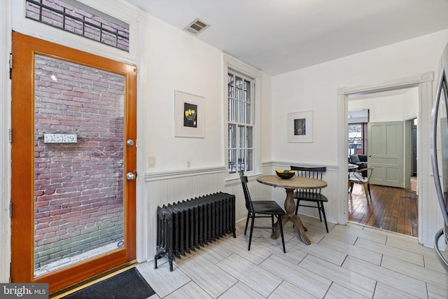 dining room featuring radiator heating unit