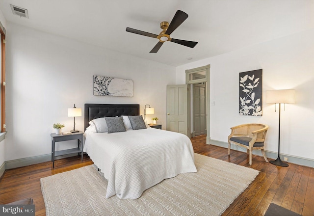 bedroom featuring ceiling fan and dark hardwood / wood-style flooring