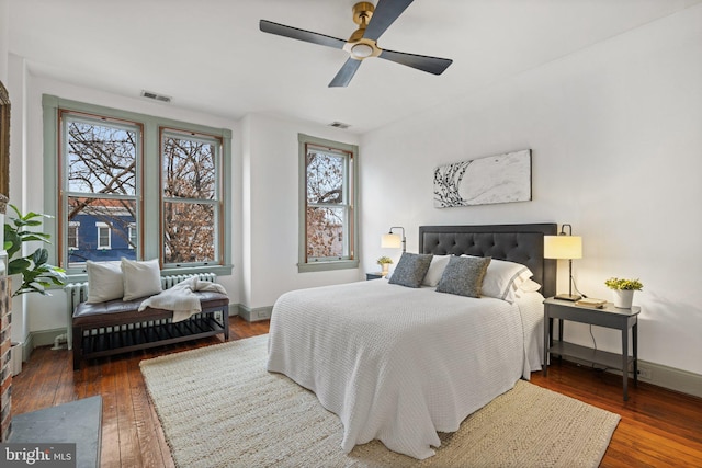 bedroom featuring dark wood-type flooring and ceiling fan