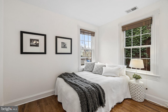 bedroom featuring dark hardwood / wood-style flooring