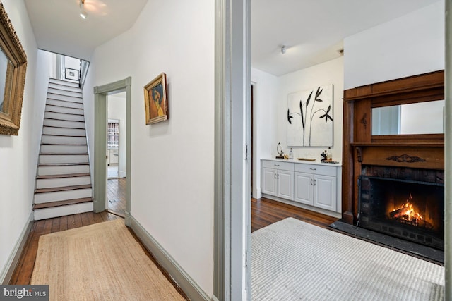 hallway featuring dark hardwood / wood-style floors