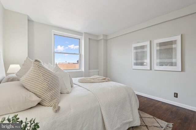 bedroom featuring dark hardwood / wood-style floors