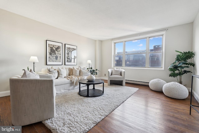 living room with a baseboard radiator and dark hardwood / wood-style floors