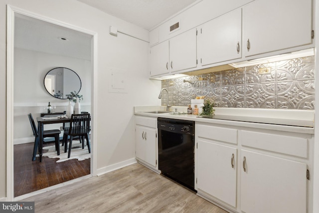 kitchen with sink, white cabinetry, dishwasher, light wood-type flooring, and decorative backsplash