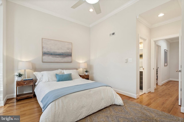 bedroom with hardwood / wood-style flooring, ornamental molding, and ceiling fan