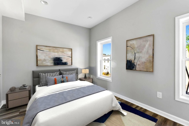 bedroom featuring dark wood-type flooring