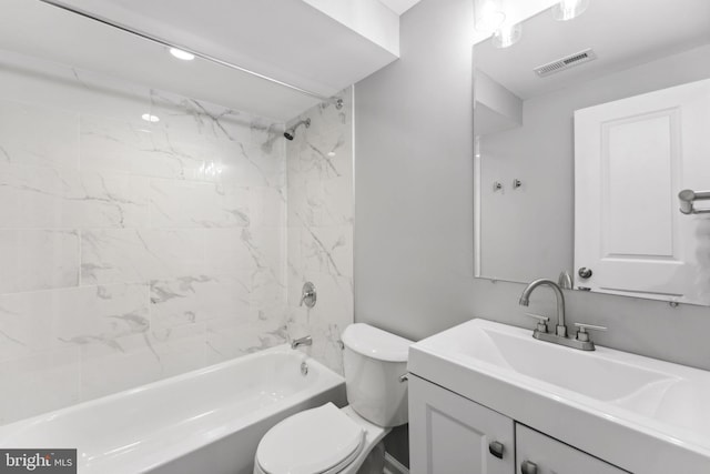 full bathroom with vanity, toilet, and tiled shower / bath