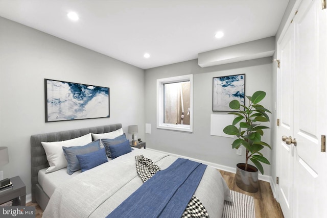 bedroom with wood-type flooring