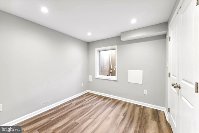 spare room featuring hardwood / wood-style floors