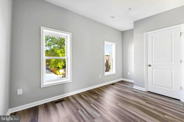 unfurnished bedroom featuring dark wood-type flooring