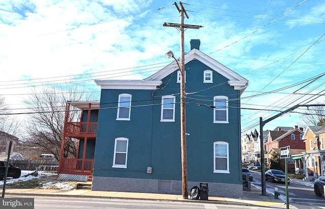 view of home's exterior with a balcony