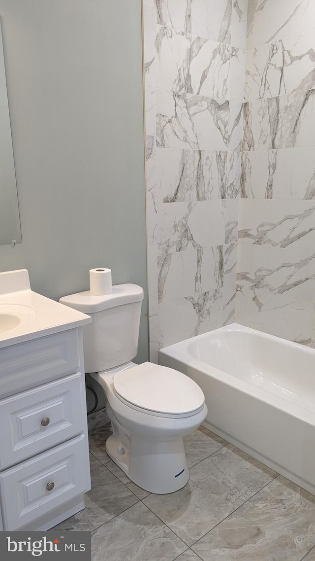 full bathroom featuring toilet, vanity, and  shower combination