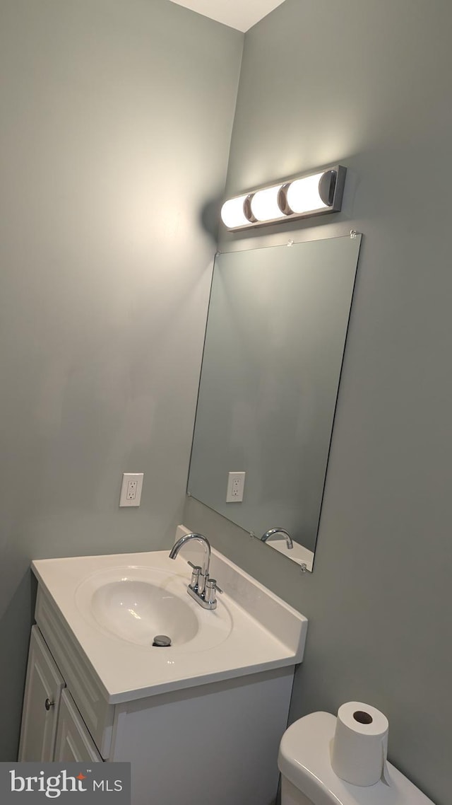 bathroom with toilet and vanity