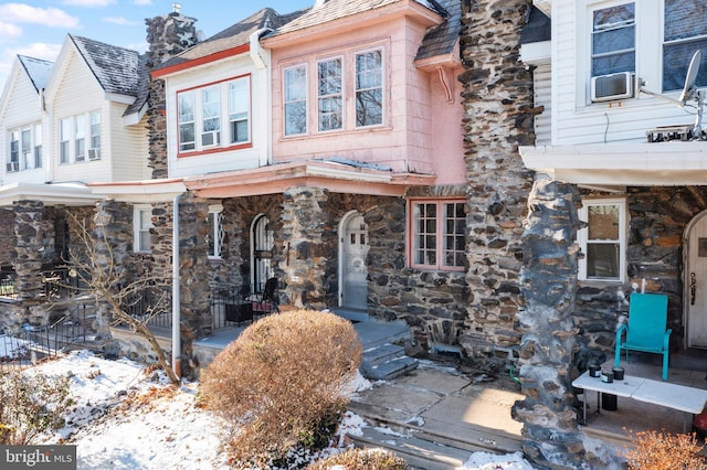 view of front of home with cooling unit