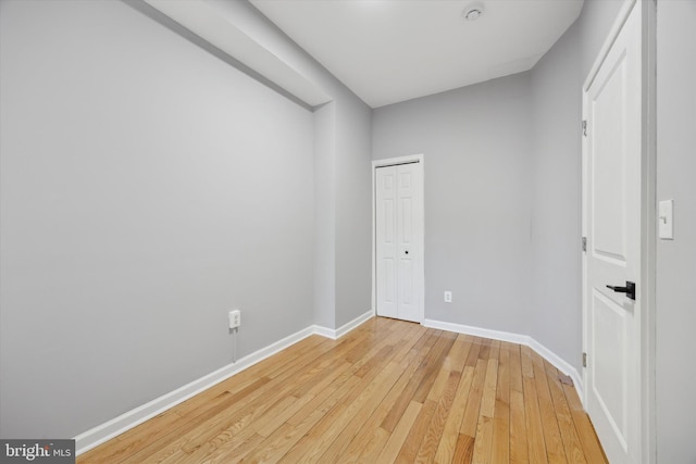 spare room with light wood-type flooring