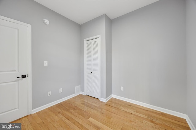 unfurnished bedroom featuring hardwood / wood-style floors