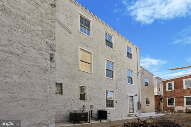 view of building exterior featuring cooling unit