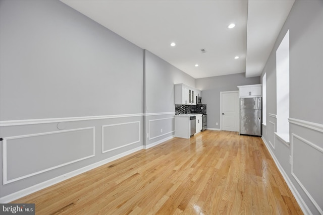 unfurnished living room with light wood-type flooring