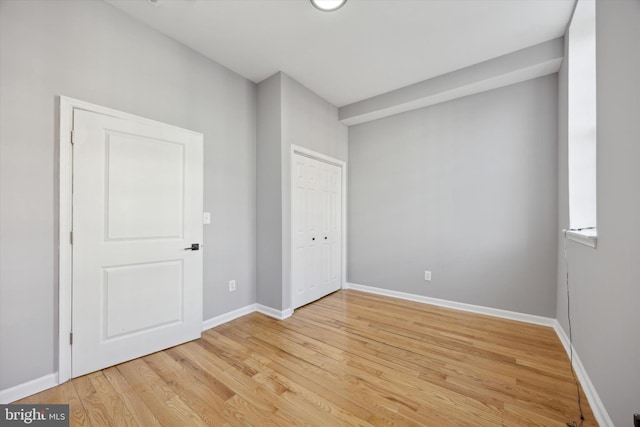 spare room featuring light hardwood / wood-style floors