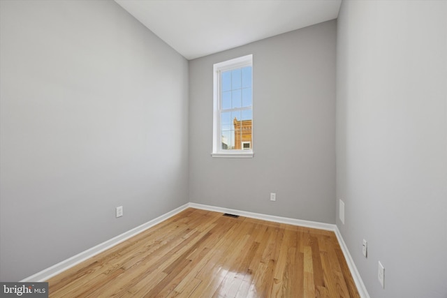 unfurnished room with light hardwood / wood-style flooring