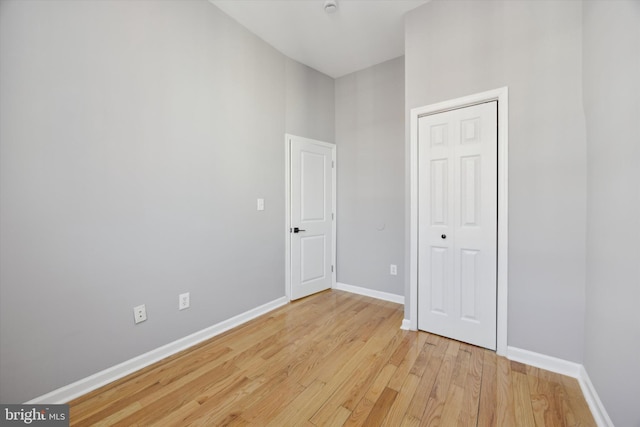 empty room with light hardwood / wood-style floors