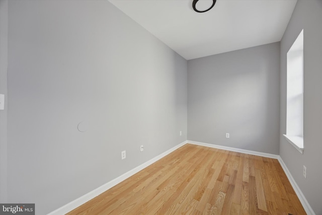 empty room featuring hardwood / wood-style flooring