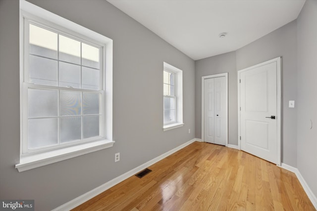 unfurnished bedroom with light hardwood / wood-style flooring