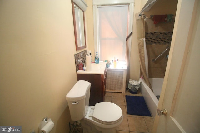 full bathroom with vanity, radiator, tiled shower / bath, tile patterned flooring, and toilet