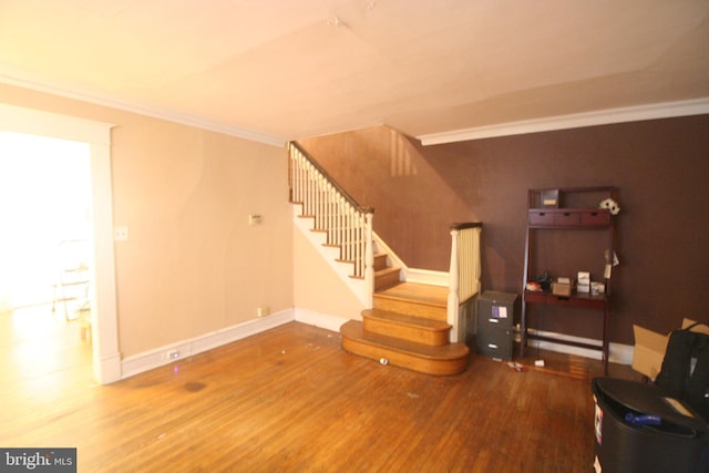 living room featuring wood-type flooring and ornamental molding