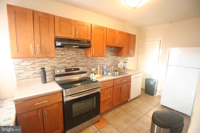 kitchen with sink, white appliances, backsplash, and light tile patterned floors