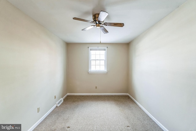 spare room featuring carpet flooring and ceiling fan