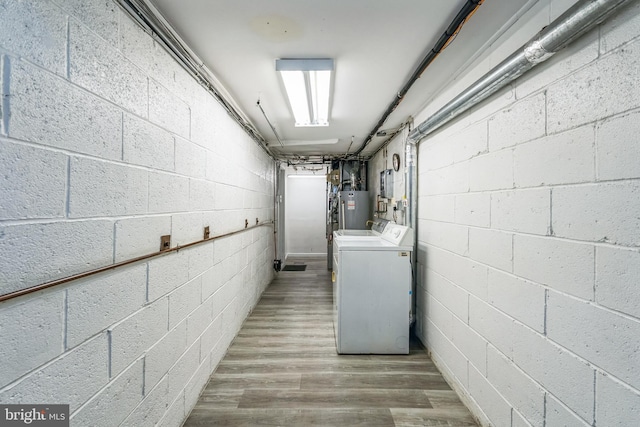 basement with gas water heater and washing machine and clothes dryer