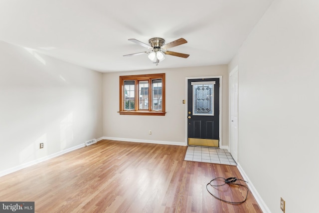 entryway featuring ceiling fan and light wood-type flooring