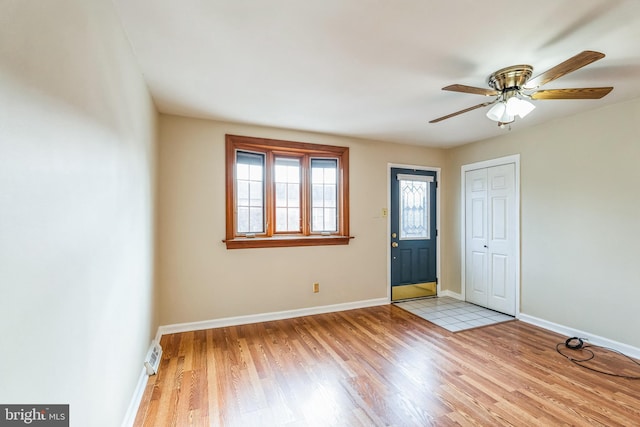 entrance foyer with light hardwood / wood-style flooring and ceiling fan