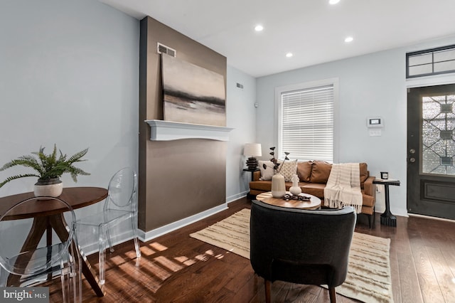 living room featuring dark wood-type flooring