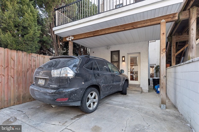 view of vehicle parking with a carport