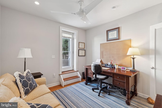 office space with wood-type flooring and ceiling fan