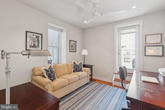 office area featuring a wealth of natural light, hardwood / wood-style floors, and ceiling fan