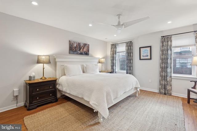 bedroom featuring hardwood / wood-style flooring and ceiling fan