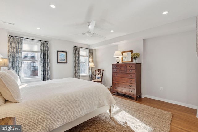 bedroom with hardwood / wood-style floors and ceiling fan